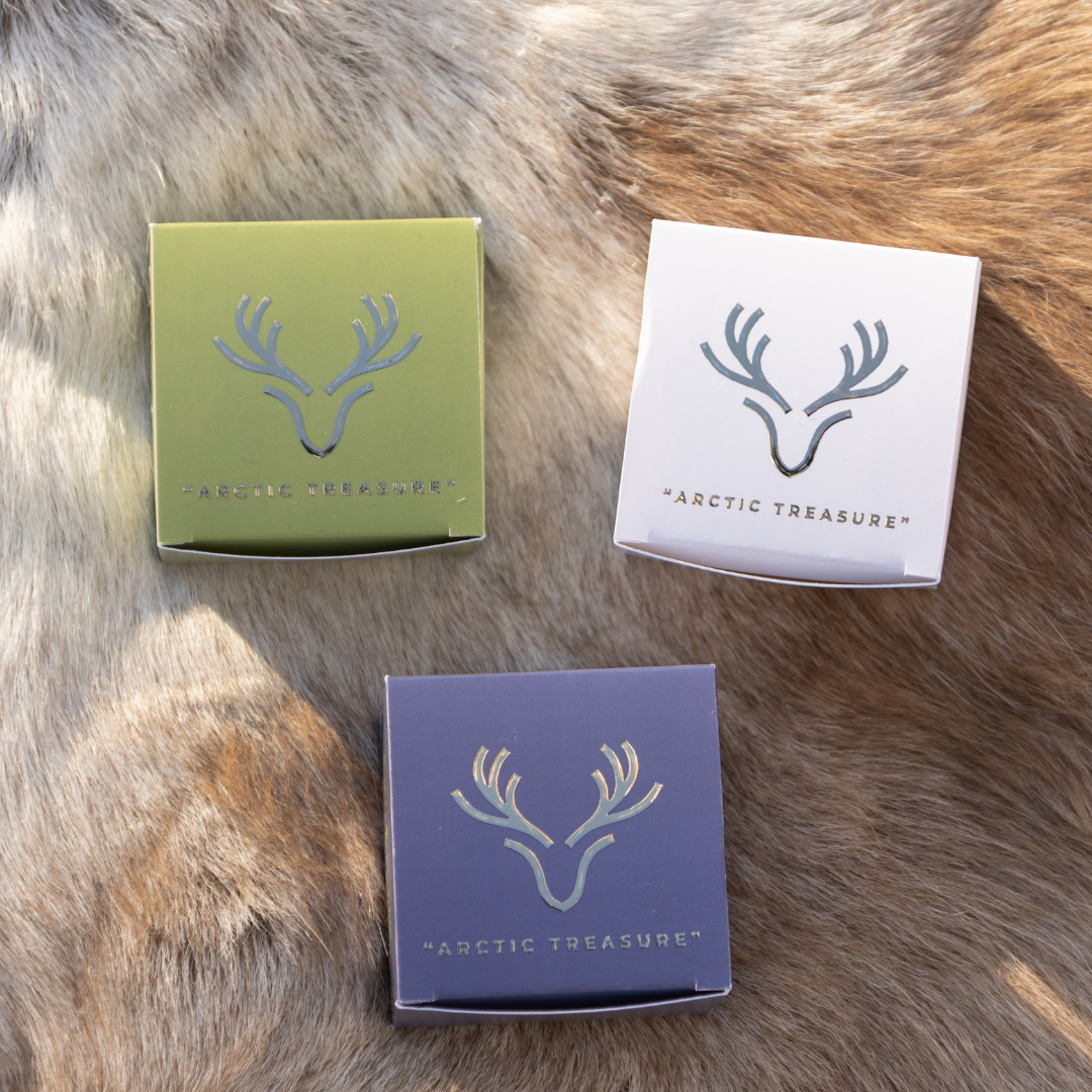 Set of 3 Arctic Treasure regenerative balms with reindeer tallow for face and body, shown in green, white and purple boxes